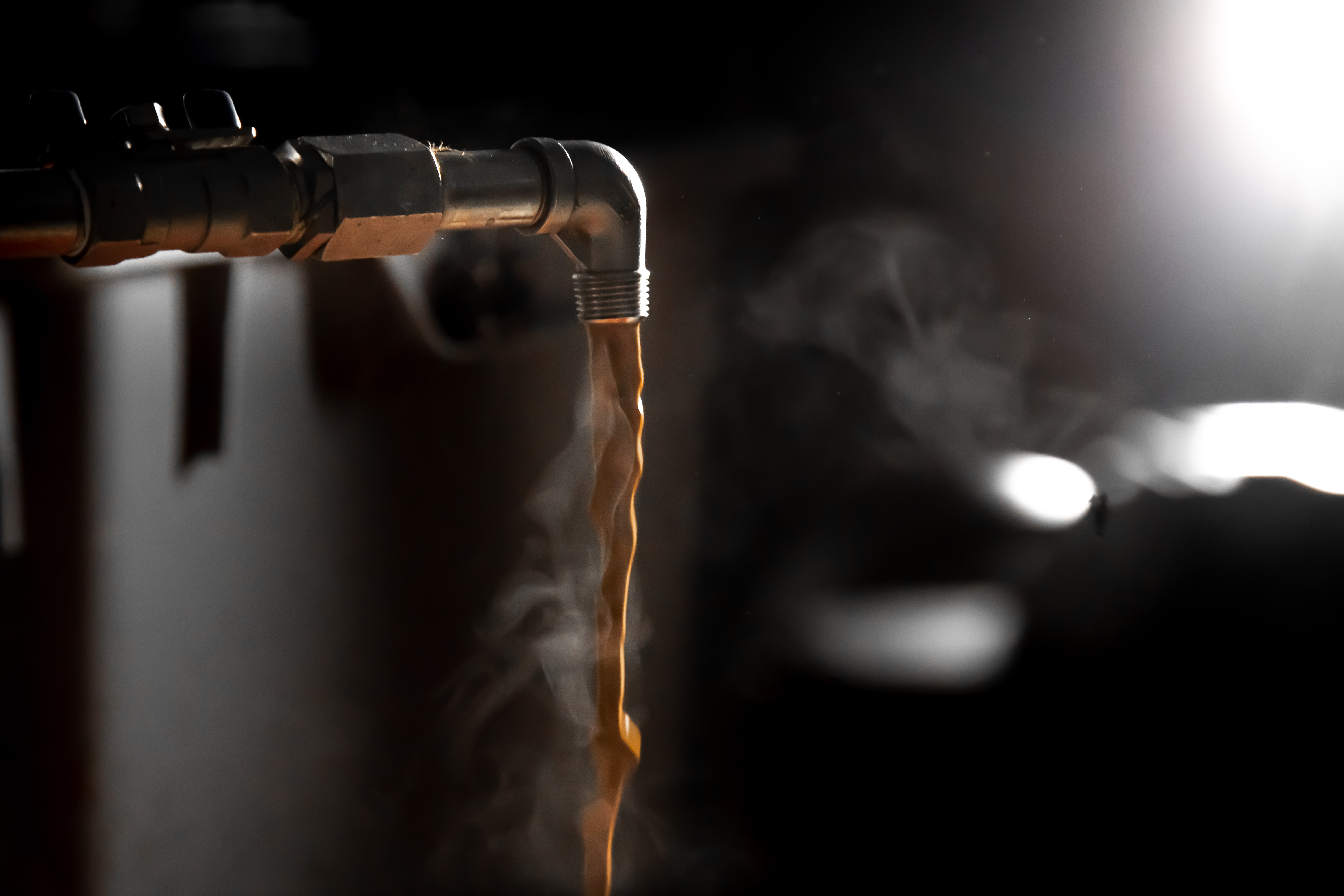 freshly brewed espresso pouring out of the SWISS ESPRESSO EXTRACTOR